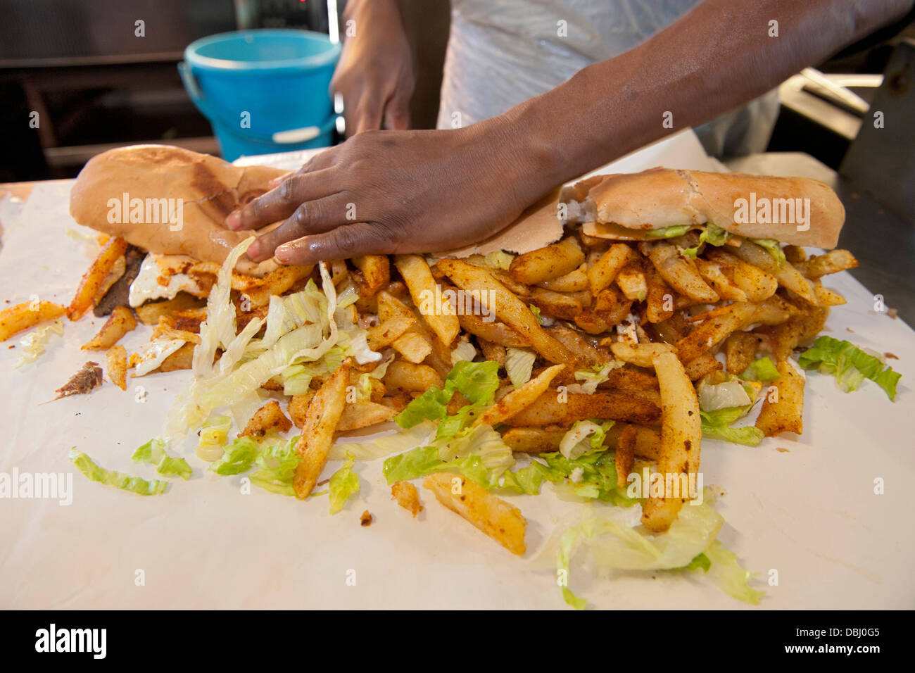 Full House gatsby sandwich being prepared at the Golden Dish take away in Athlone, Cape Town, South Africa. Stock Photo