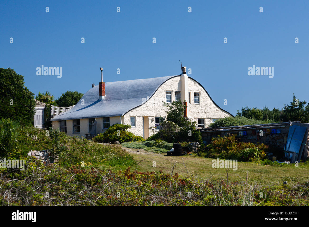 House with curved roof for wind deflection on Gugh Isles of Scilly Stock Photo