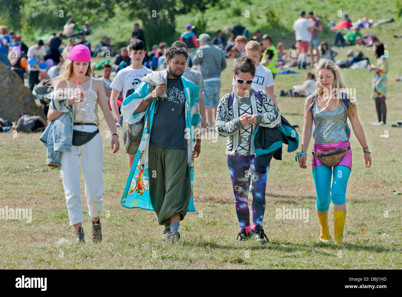 Glastonbury Festival 2013 UK - A group of friends walk from their camping site to the main arena Stock Photo