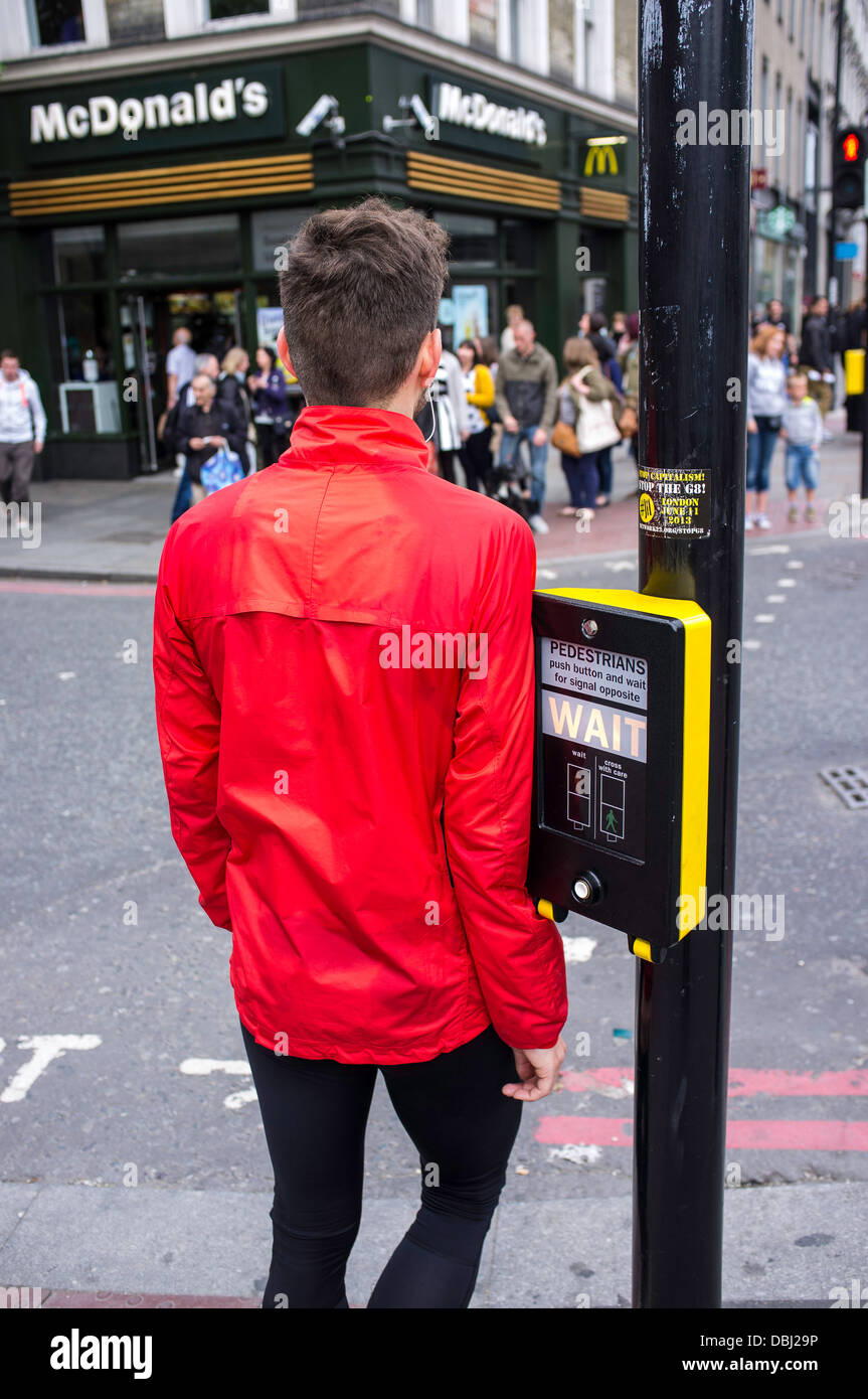 Man in orange jacket Stock Photo Alamy
