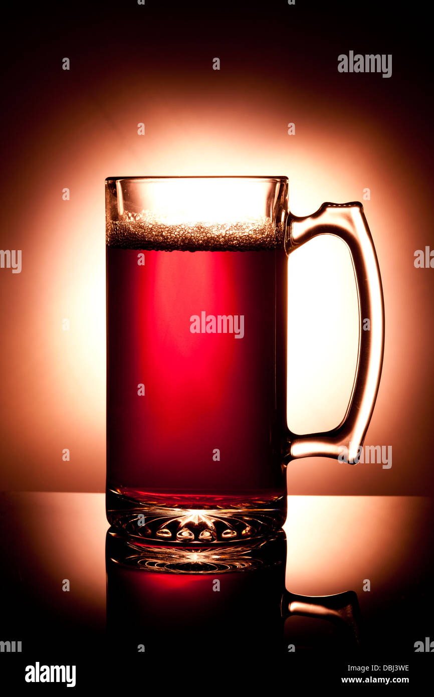 A studio image of a large mug of beer that is back lit. Stock Photo