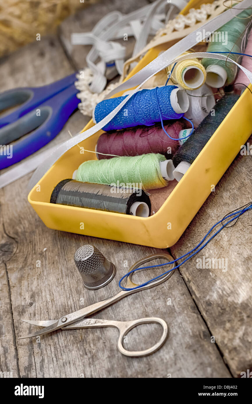 Instruments of repairman clothing and thread Stock Photo Alamy