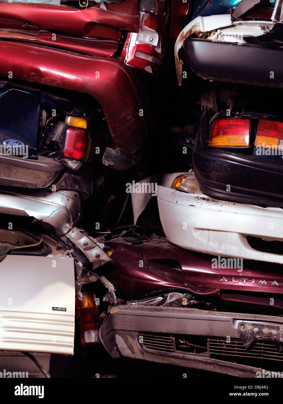 Piled up crushed cars on a scrap yard Stock Photo