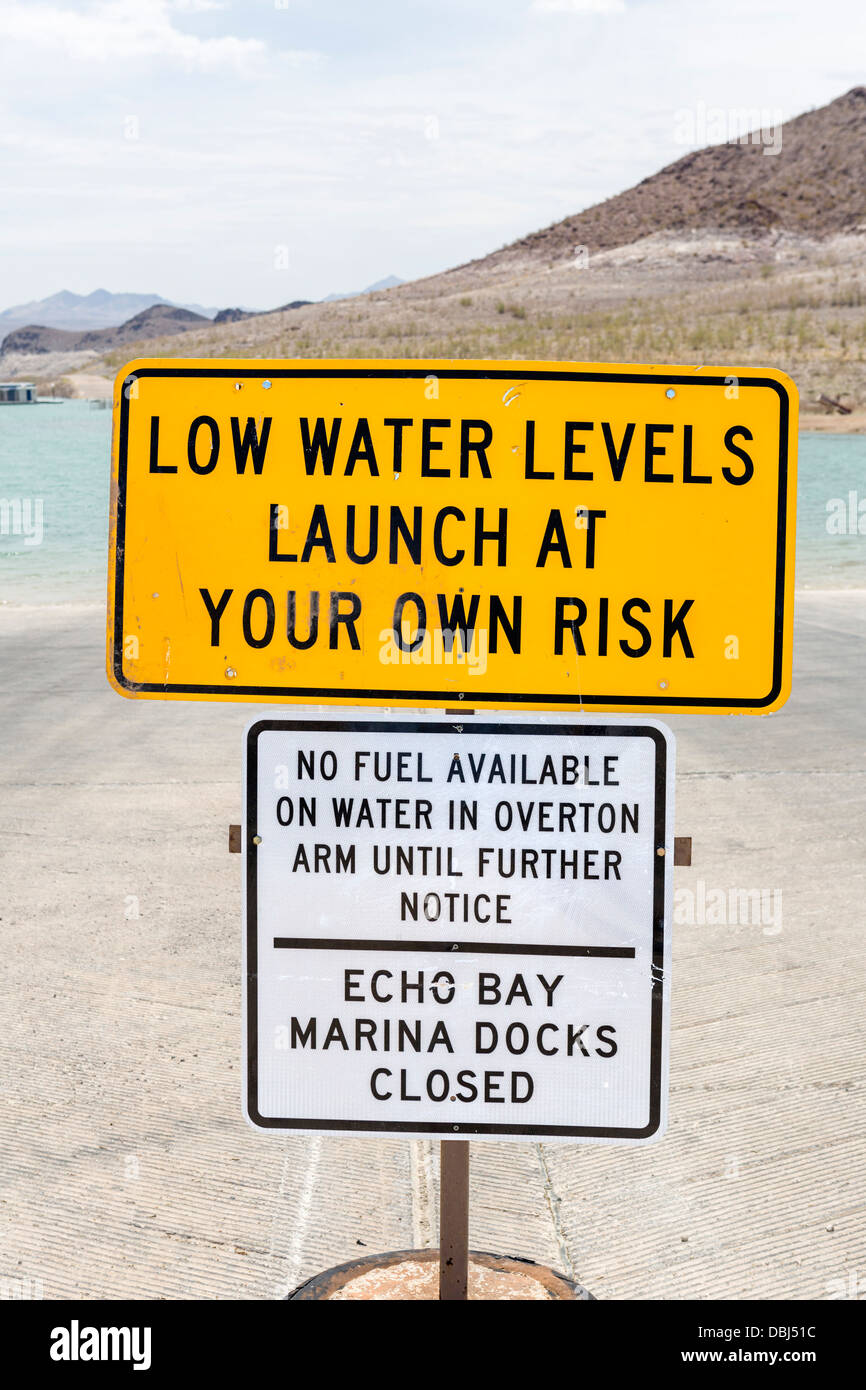 Warning of low water levels on boat ramp at Lake Mead in summer 2013, Echo Bay Marina, Lake Mead, Nevada, USA Stock Photo