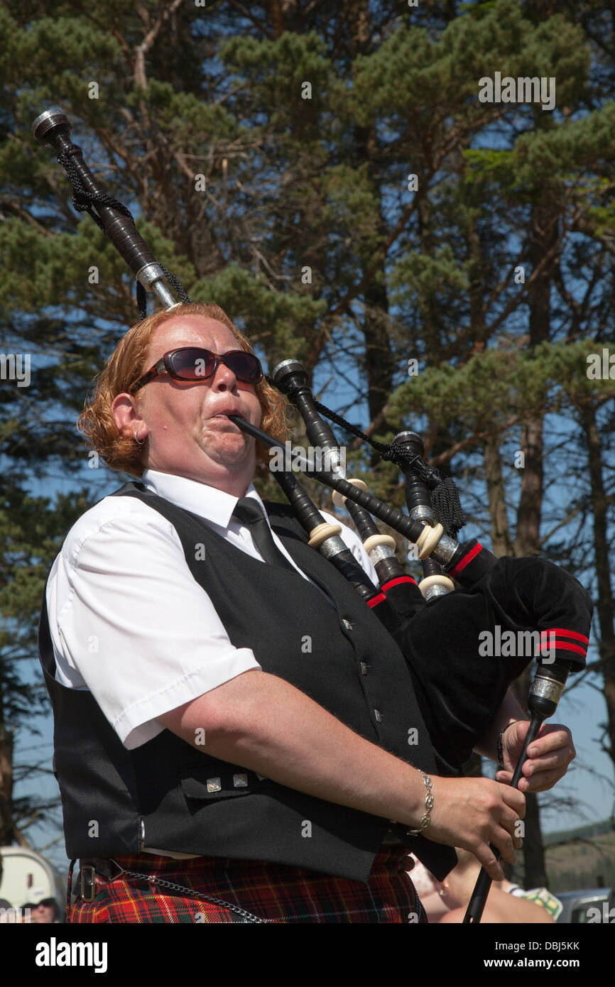 Fiona Caldwell 37, Scottish female Piper at the annual Tomintoul Highland games and gathering held  at the showground in Tomintoul, Scotland, UK Stock Photo