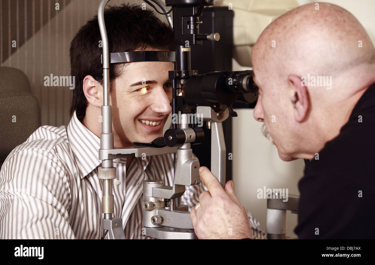Optometrist examining patient Stock Photo Alamy