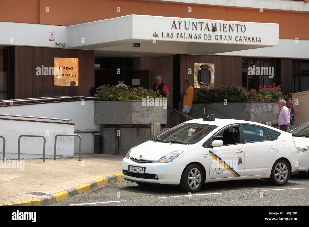 People entering and leaving the 'ayuntamiento'  (local council) building in Las Palmas, Gran Canaria. Stock Photo