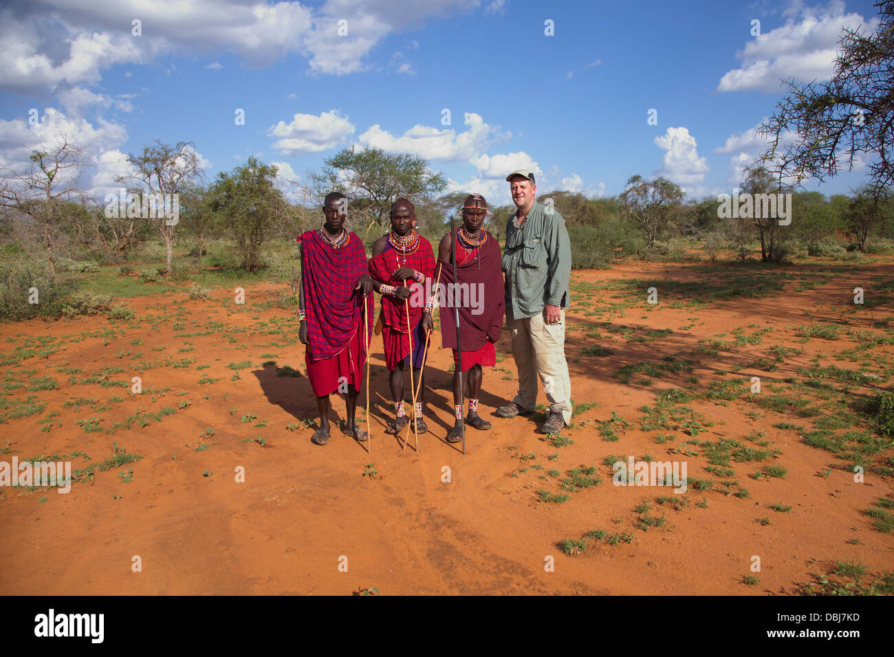 Masai warriors pose with photographer. Ol Kinyei conservancy. Kenya, Africa. Stock Photo