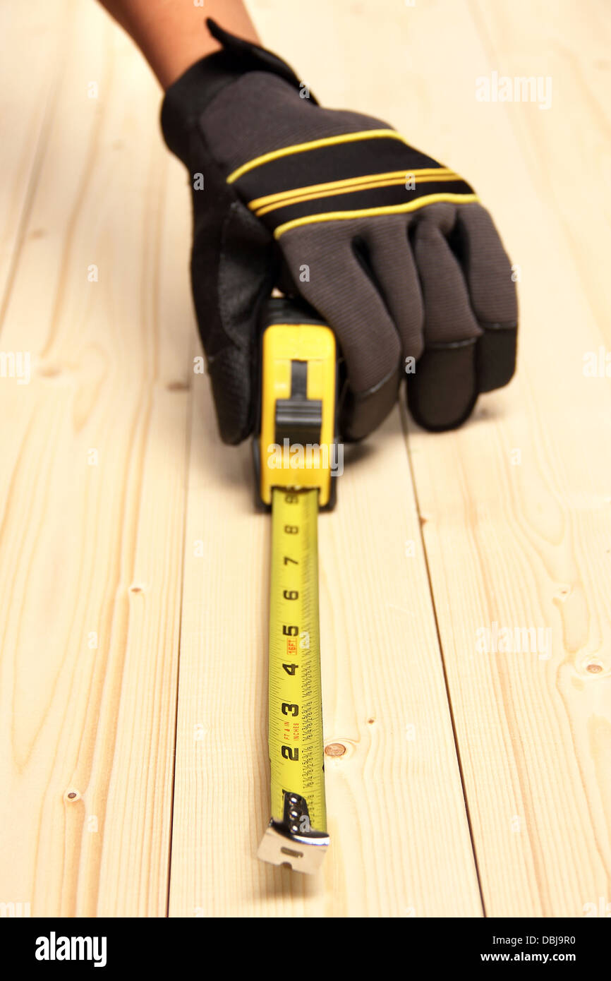 Measuring block wood using measuring hires stock photography and