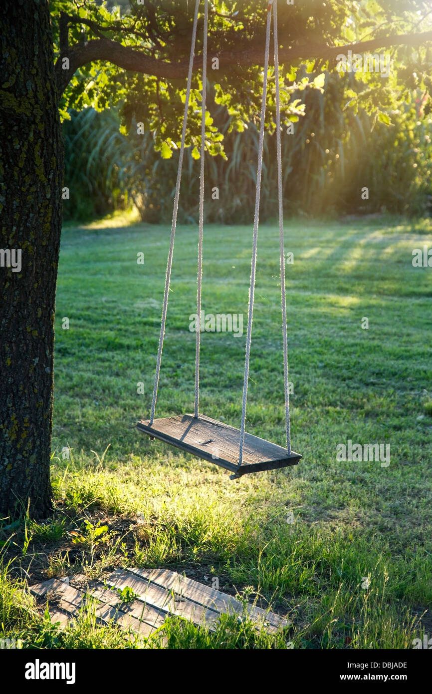 Old wooden tree swing hi-res stock photography and images - Alamy