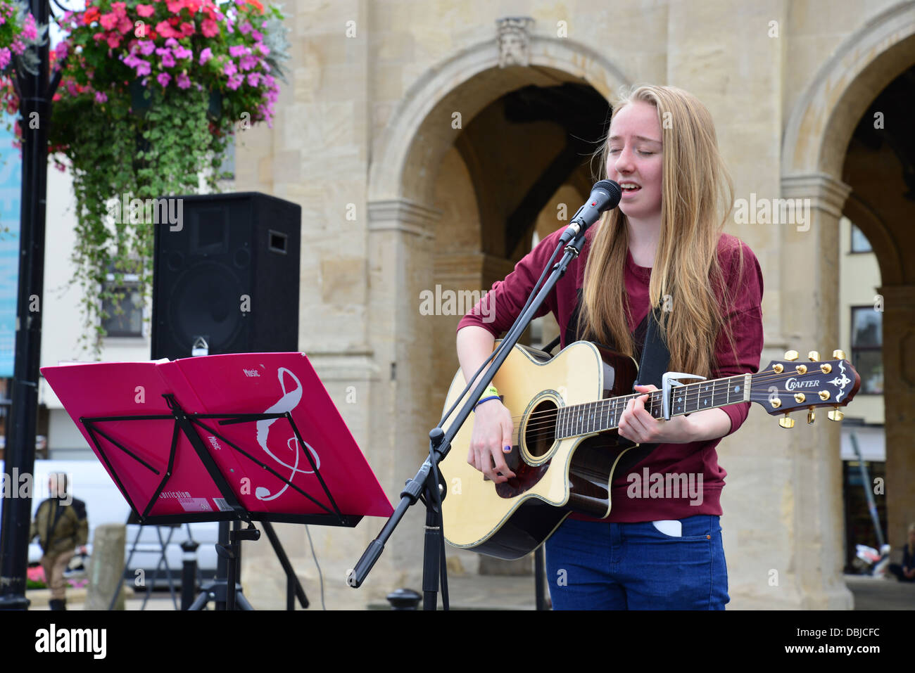 Young female singer performing at Abingdon Music Event, Market Place