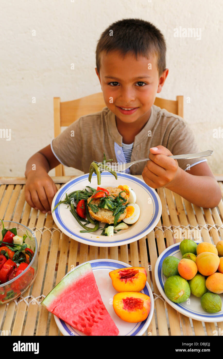 6yearold boy eating fruit and vegetables Stock Photo Alamy