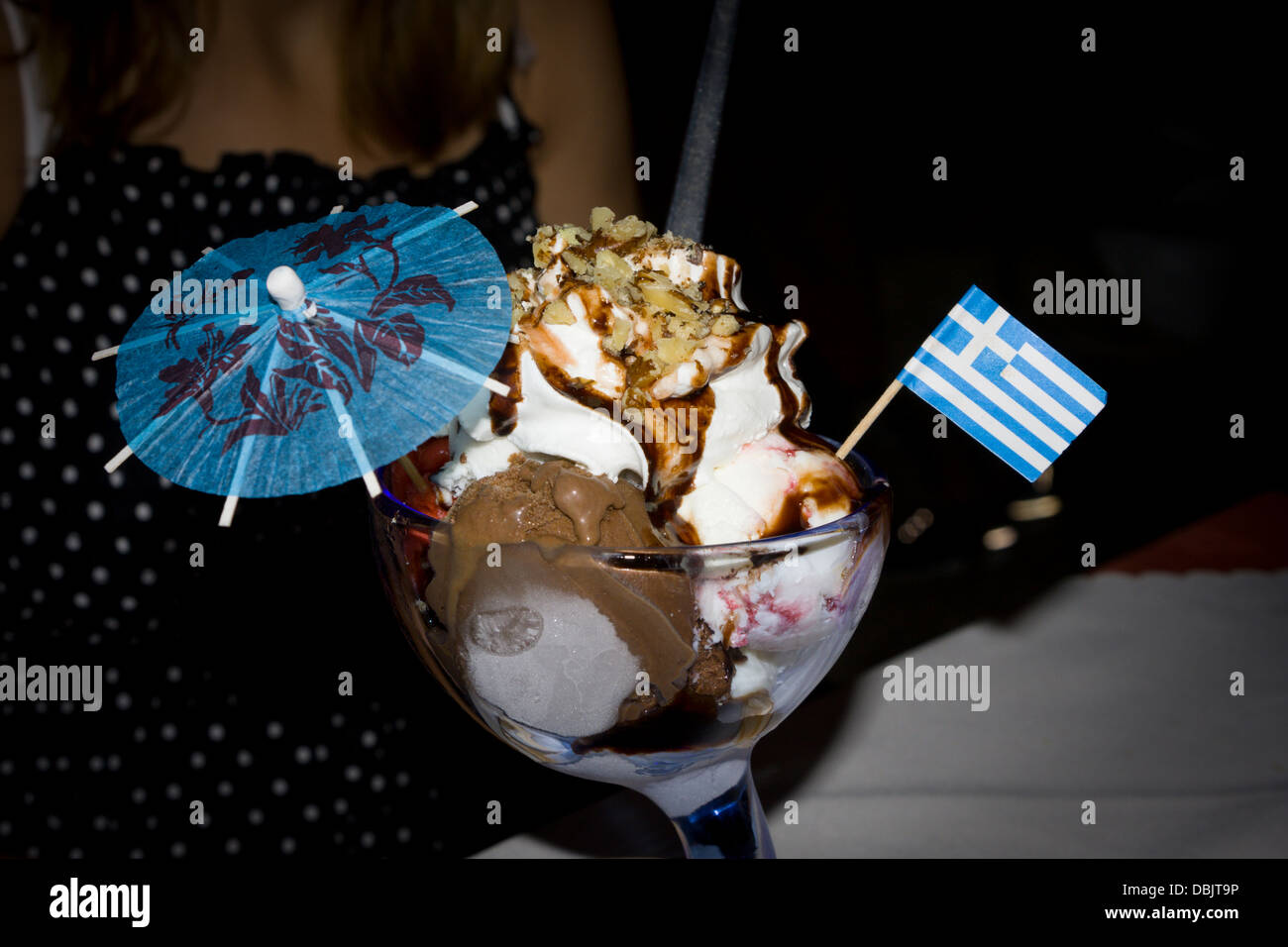 Ice cream sundae with umbrella and Greek flag Stock Photo