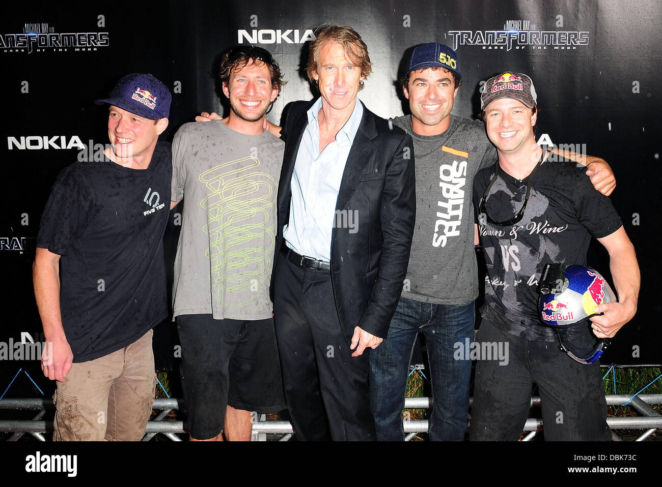 Director, Michael Bay (C) and the Red Bull parachute jumpers attend the  special red carpet VIP