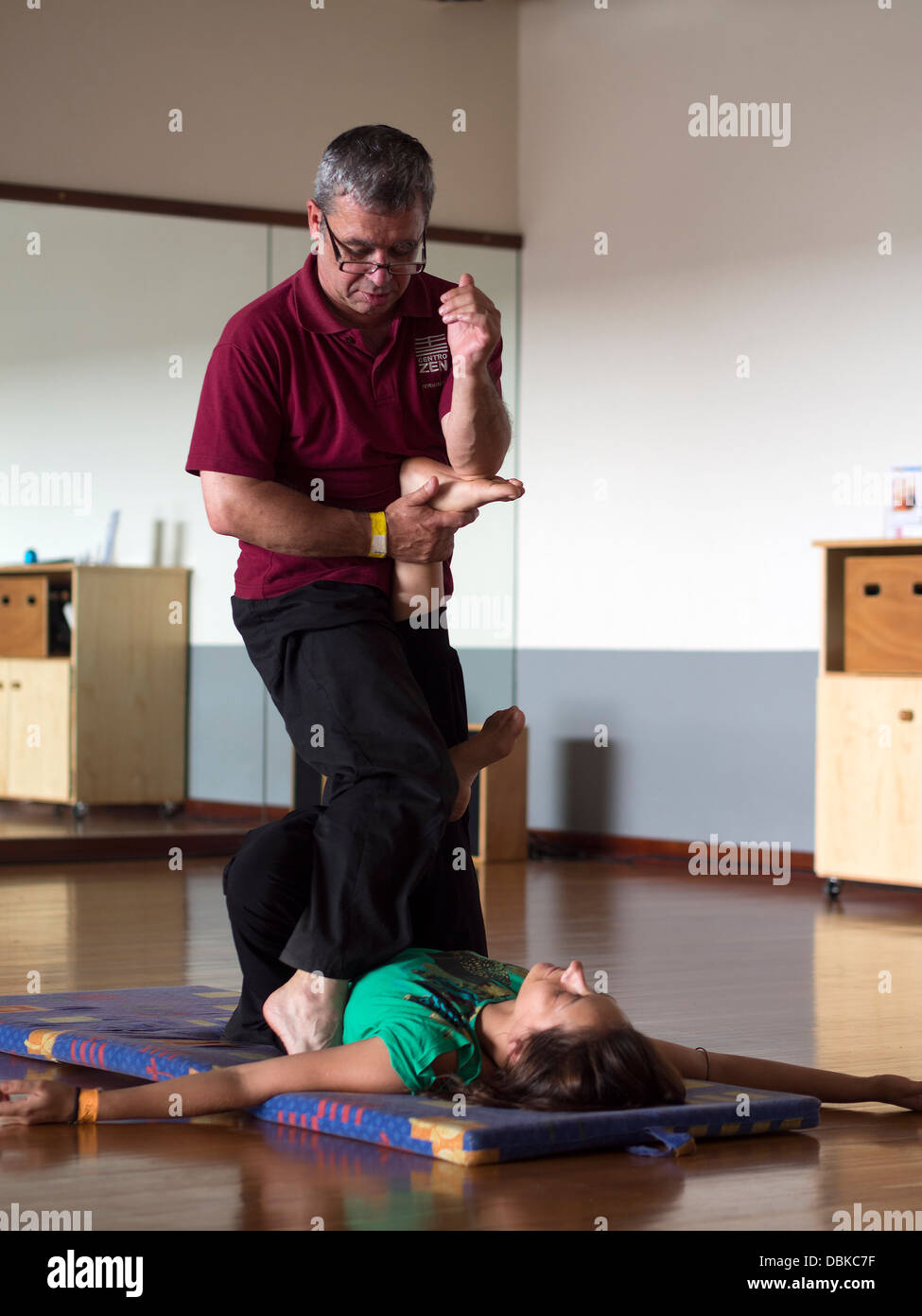 Man doing Thai massage Stock Photo