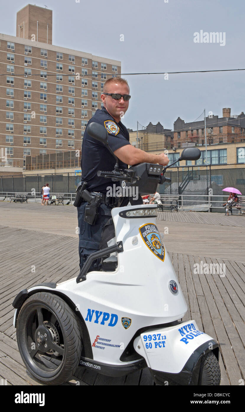 Portrait of a policeman patrolling on a Segway on the boardwalk in Brighton Beach Brooklyn, New York Stock Photo