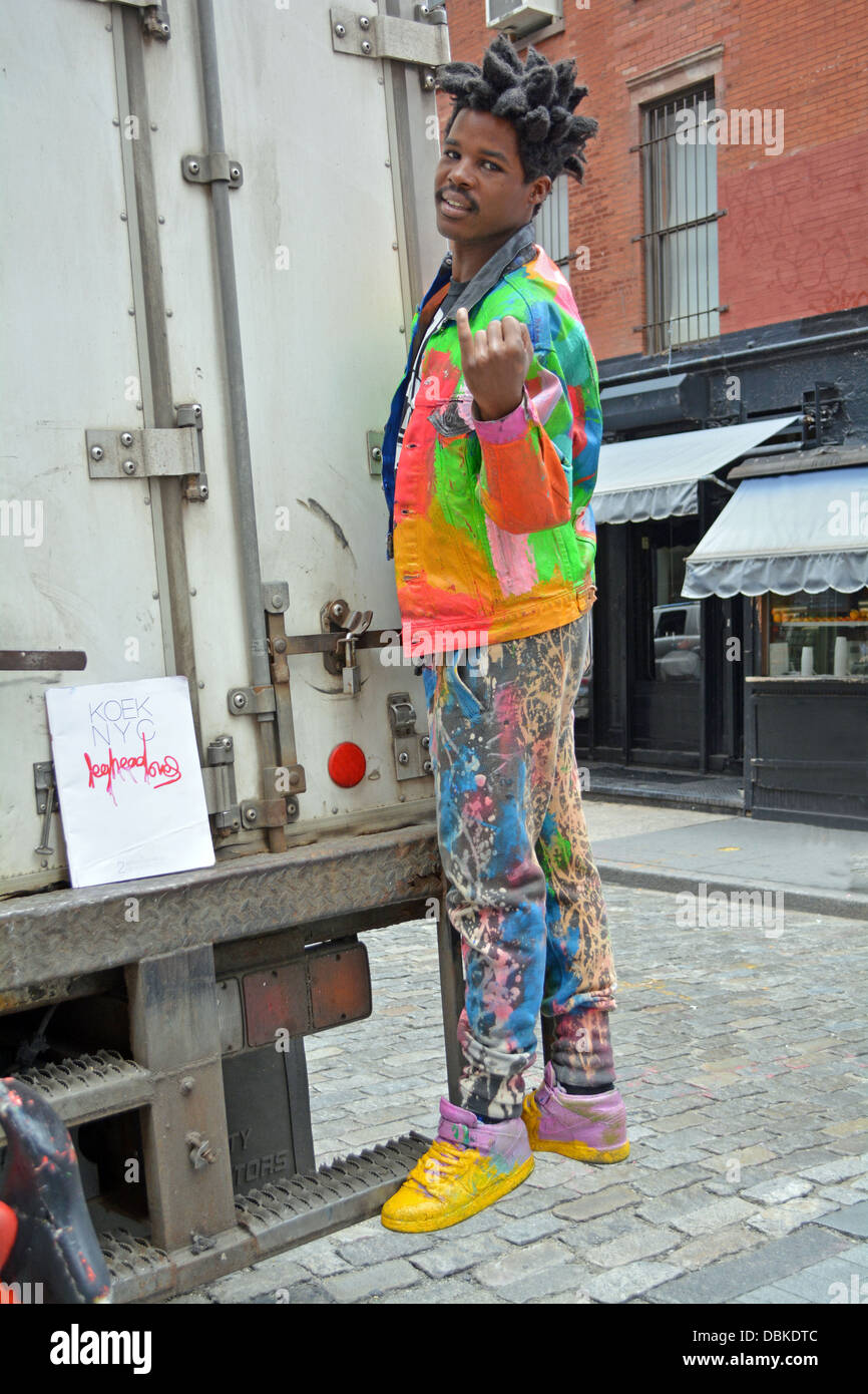 Portrait of Sidi known as Leghead, a New York artist, posing with one of his creations in the Soho section of downtown, NYC Stock Photo