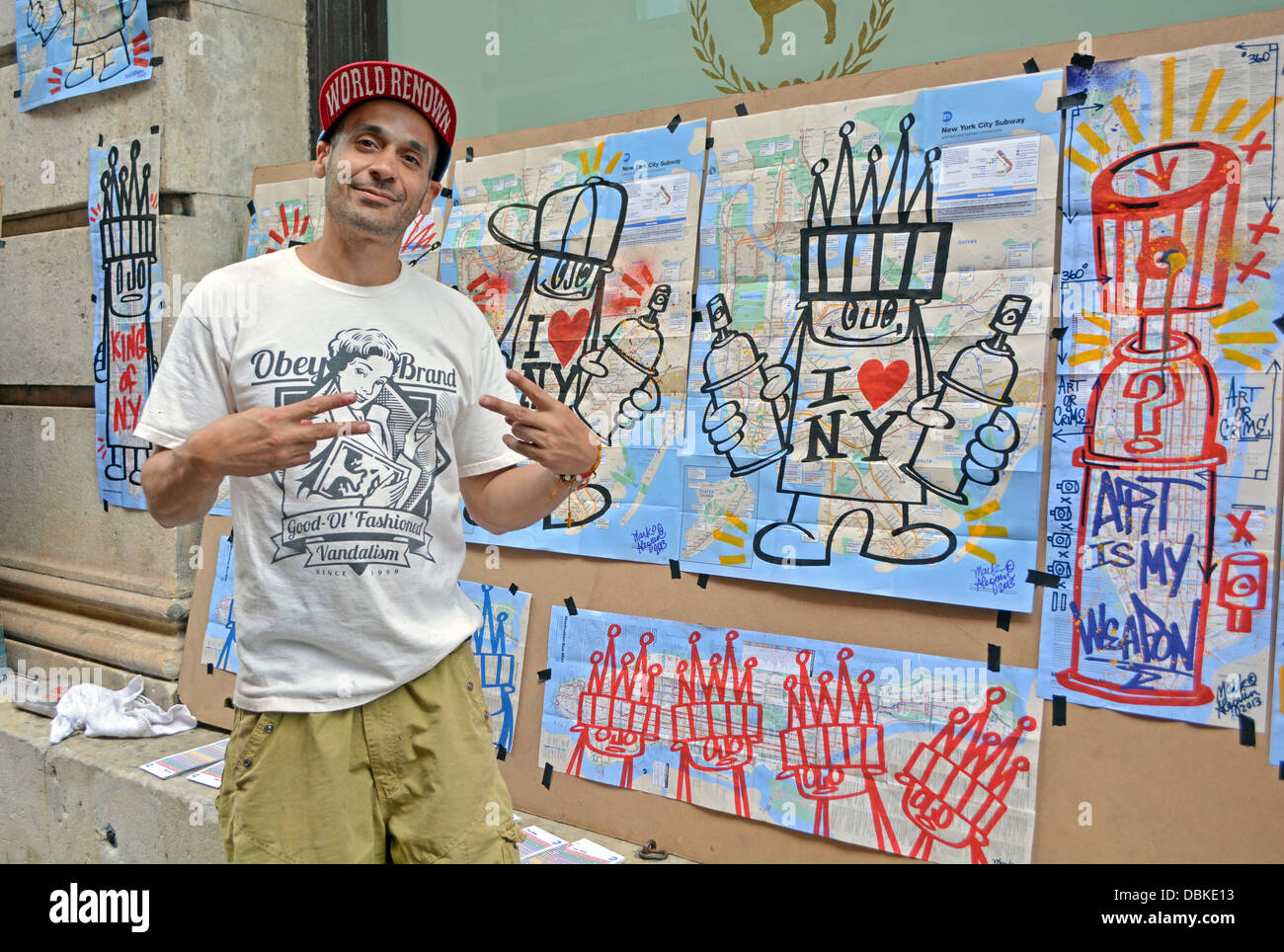 Portrait of New York City graffiti artist Mark Alequin in front of his work for sale in Soho, downtown New York City. Stock Photo