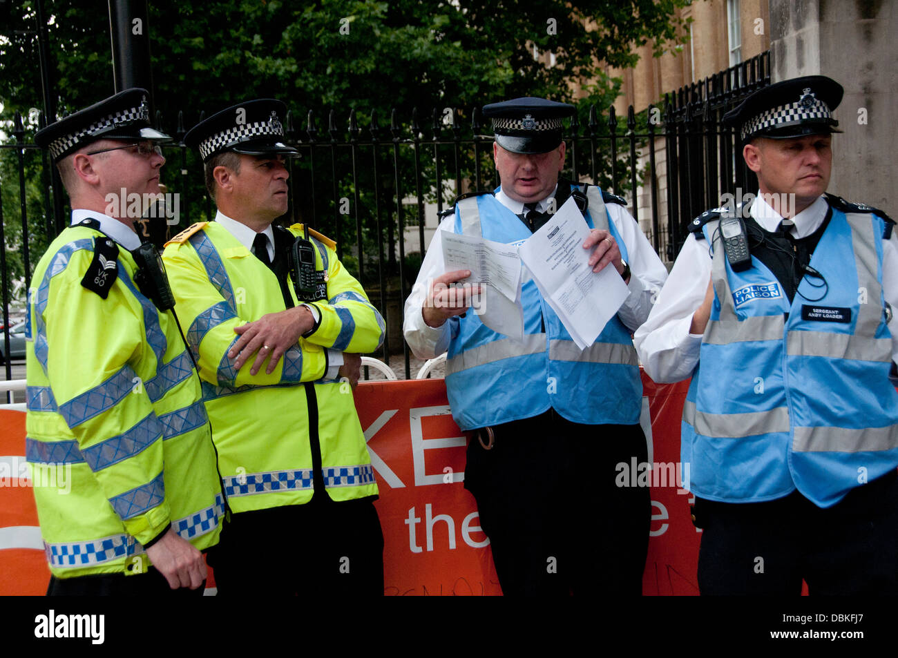 A group of Metropolitan Police Officers and Liaison Officers discussing policing of protest march London Stock Photo