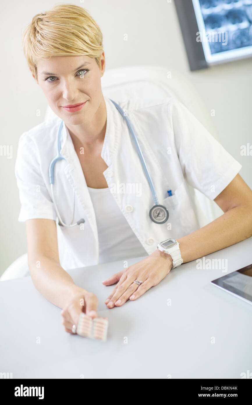 Gynecologist Holding Birth Control Pill in Hands Stock Photo