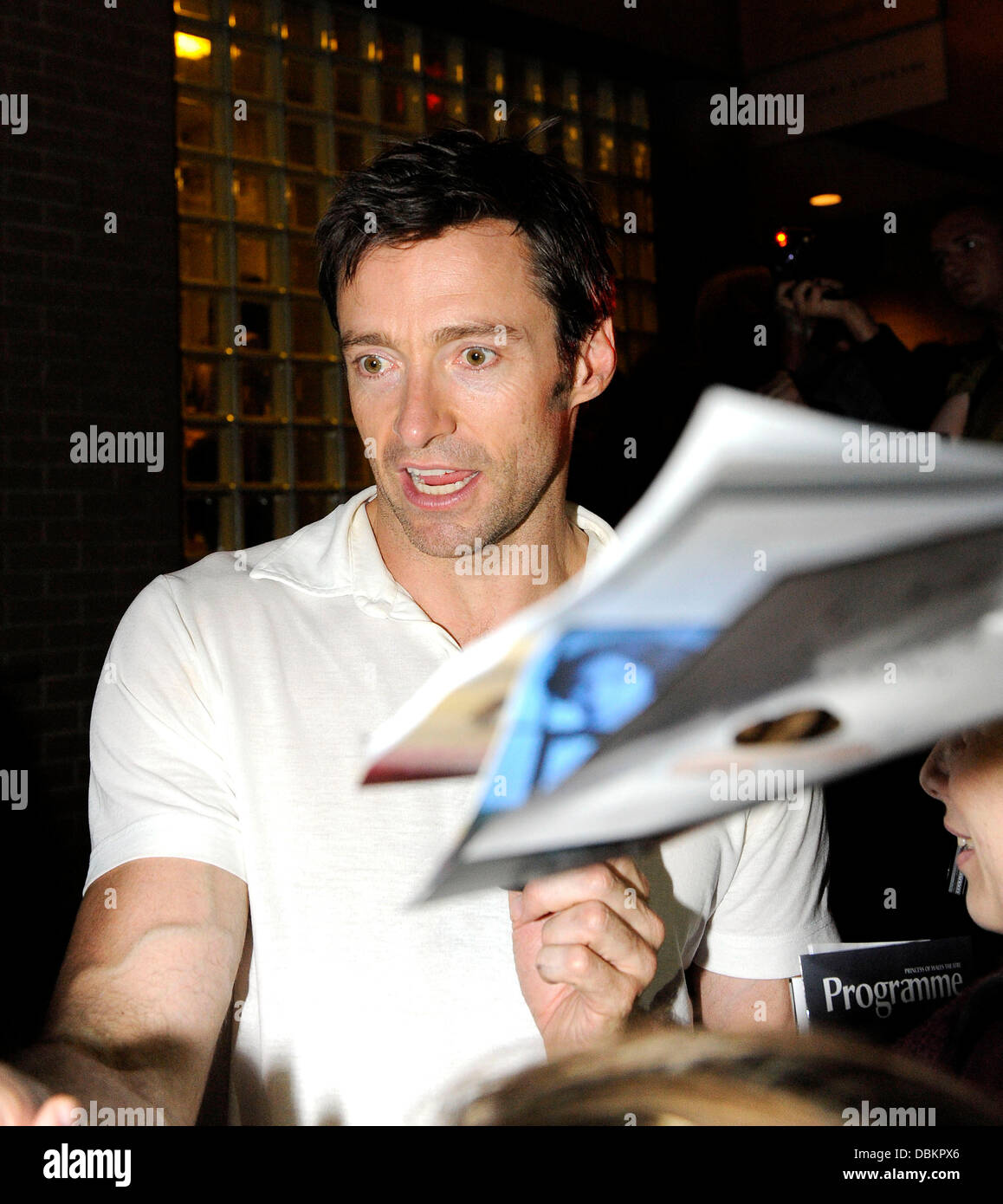Hugh Jackman greets fans as he departs the Prince of Wales Theatre