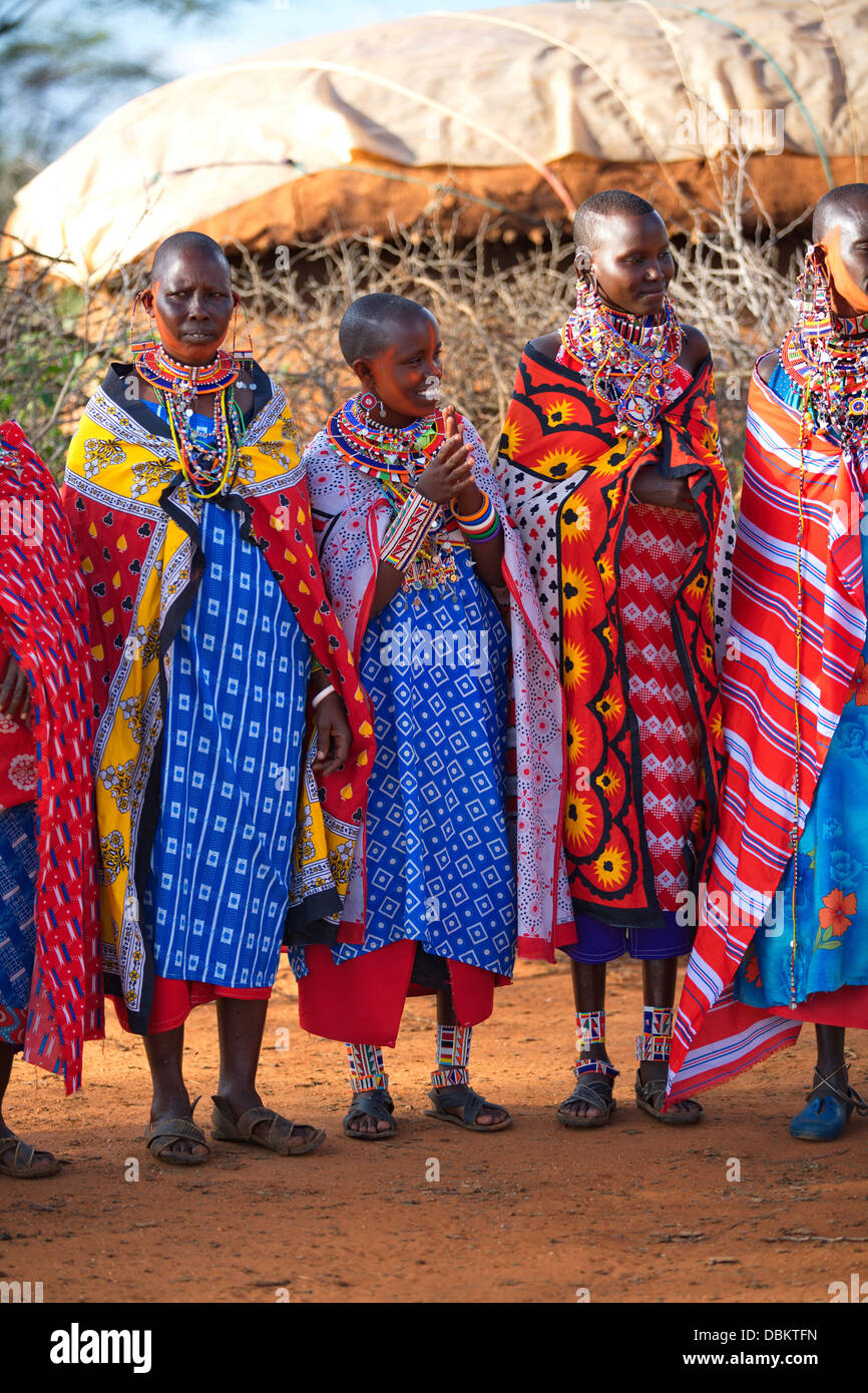 Masai Villagers in traditional clothing outside boma. Selenkay ...