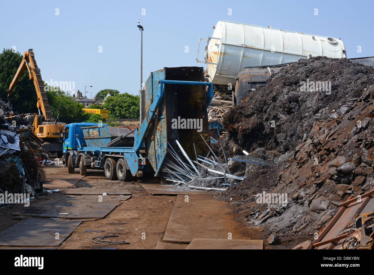 lorry emptying skip load of scrap metal for processing at scrapyard united kingdom Stock Photo