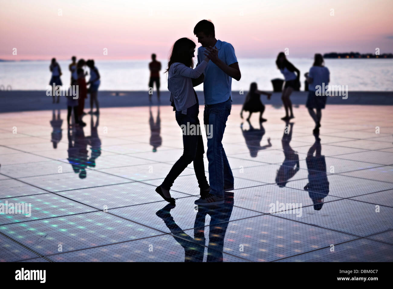 Croatia, Dalmatia, Solar panels as a dance floor, sunset in background Stock Photo