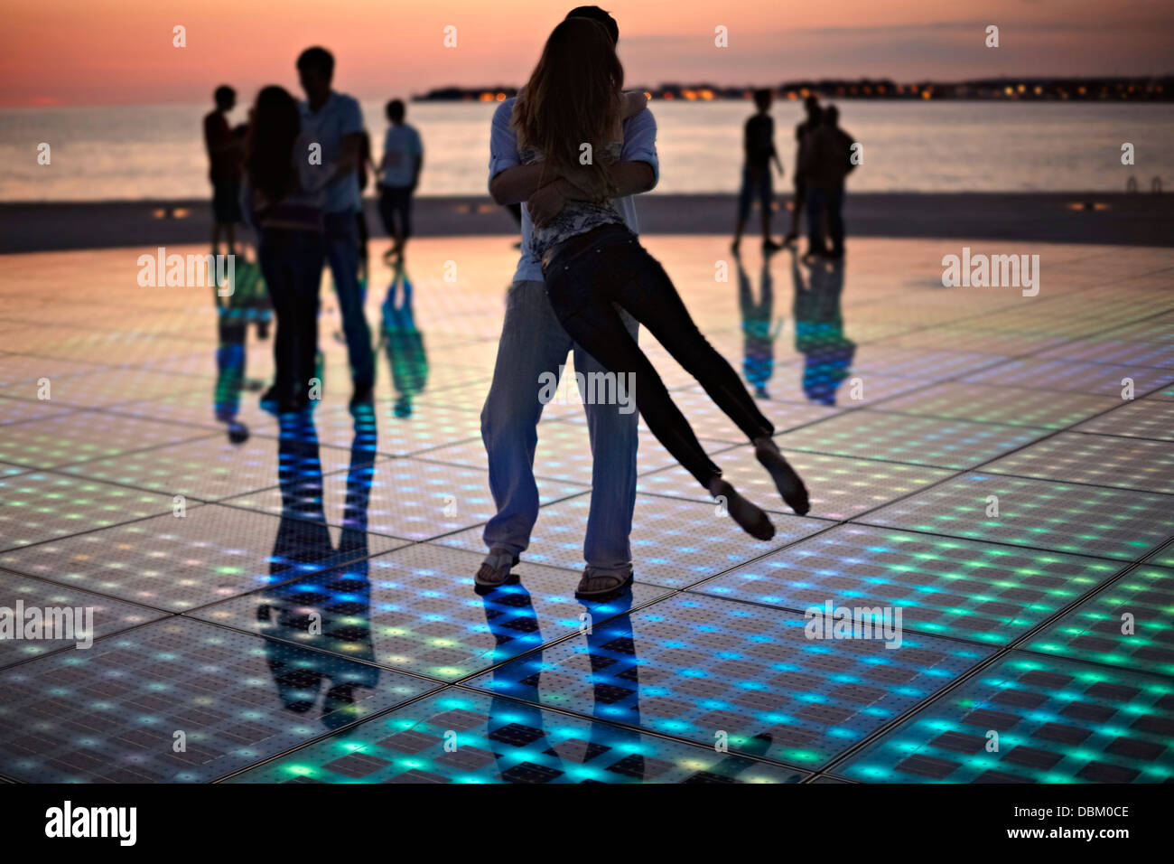 Croatia, Dalmatia, Solar panels as a dance floor, sunset in background Stock Photo