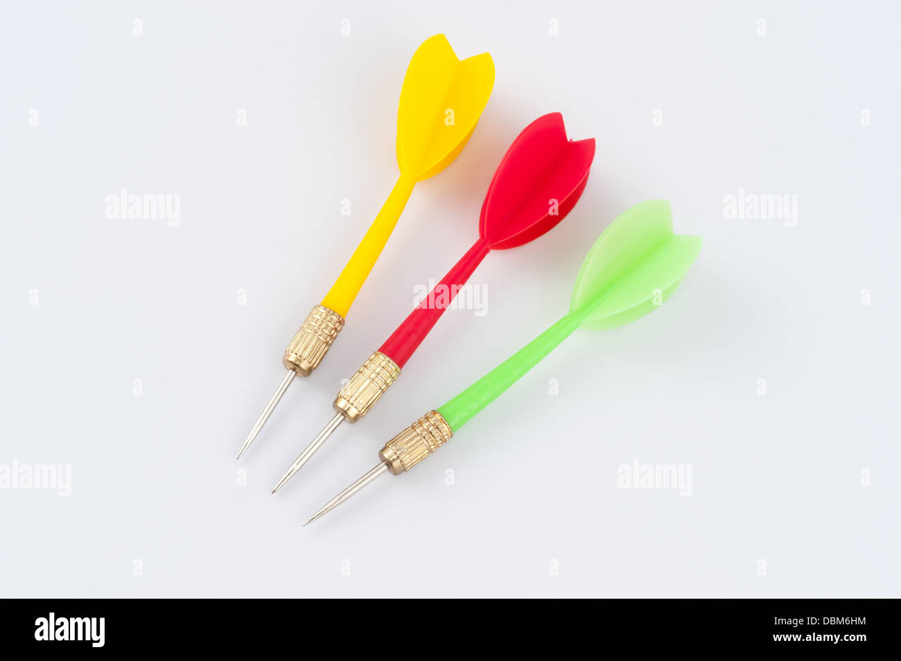 Three darts with different colors of yellow, red and green Stock Photo