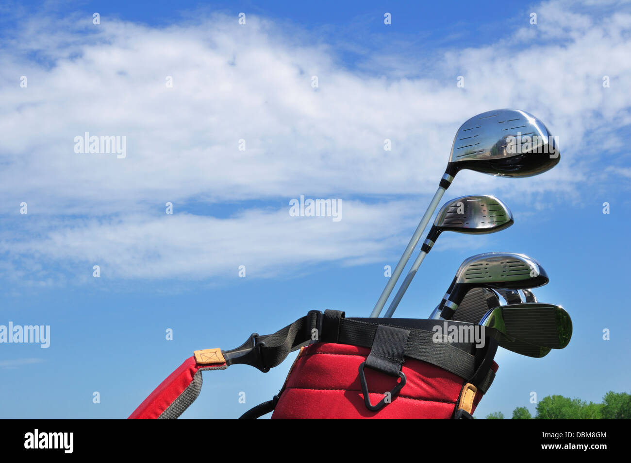 Golf Clubs in a Red Bag, putter, irons, driver, 3 wood and hybrid Stock Photo