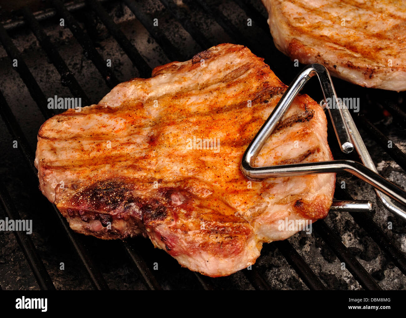 Pork Chop on a BBQ grill Stock Photo