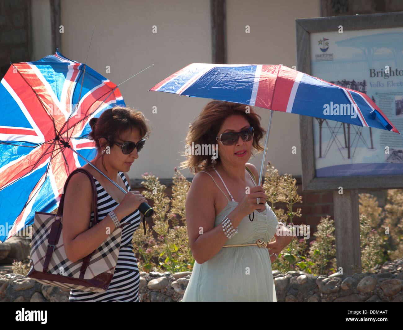 On a sunny day in Brighton,Union Jack Flag umbrellas are used for shade