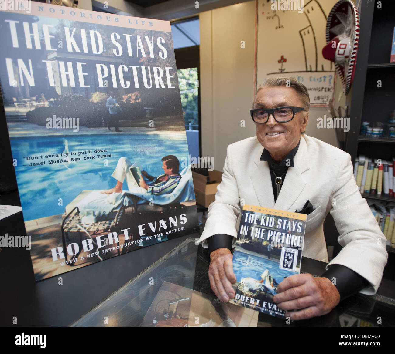 Hollywood, California, USA. 31st July, 2013. Hollywood producer Robert Evans' tell-all book details his life in Hollywood as an actor and later a movie producer bringing films like The Godfather, Chinatown and Urban Cowboy to the silver screen. According to Evans the title for his book comes from his role as Pedro Romero in the 1957 adaption for Hemingway's book The Sun Also Rises---Darryl Zanuck had cast Evans in the role against the wishes of Ava Gardner and Hemingway.----ROBERT EVANS sits with his book at Book Soup before doing a reading and signing the book for about 150 admirers.///AD Stock Photo