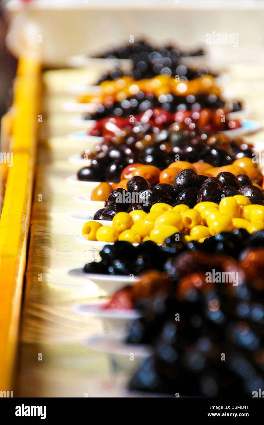 A market stall with a variety of Greek olives in Thessaloniki. Greece is amongst the largest producers of olives and olive oil. Stock Photo