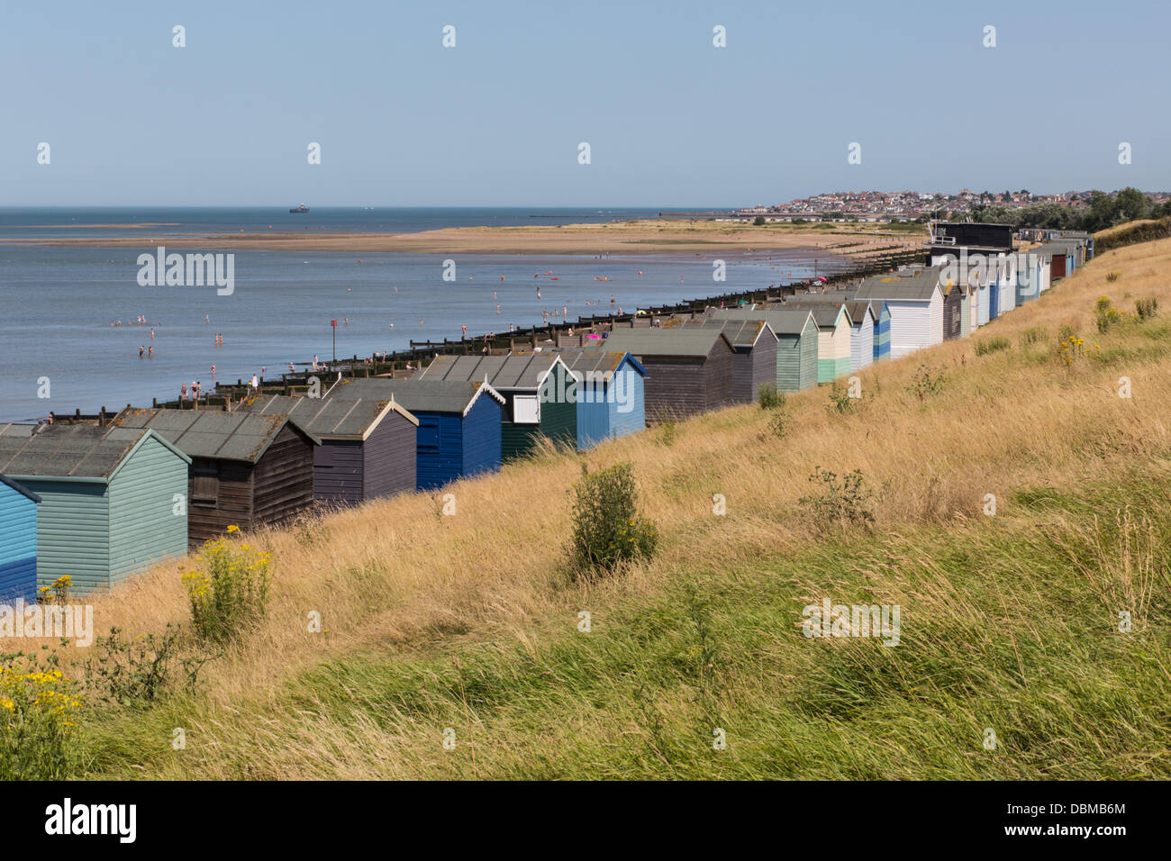Whitsable, Kent, UK - Aug 1st, 2013: As temperatures soar tourists and locals head to the seafront in Tankerton, near Whitstable. Many choose to cool off in the shallow low tide water. Credit:  CBCK-Christine/Alamy Live News Stock Photo