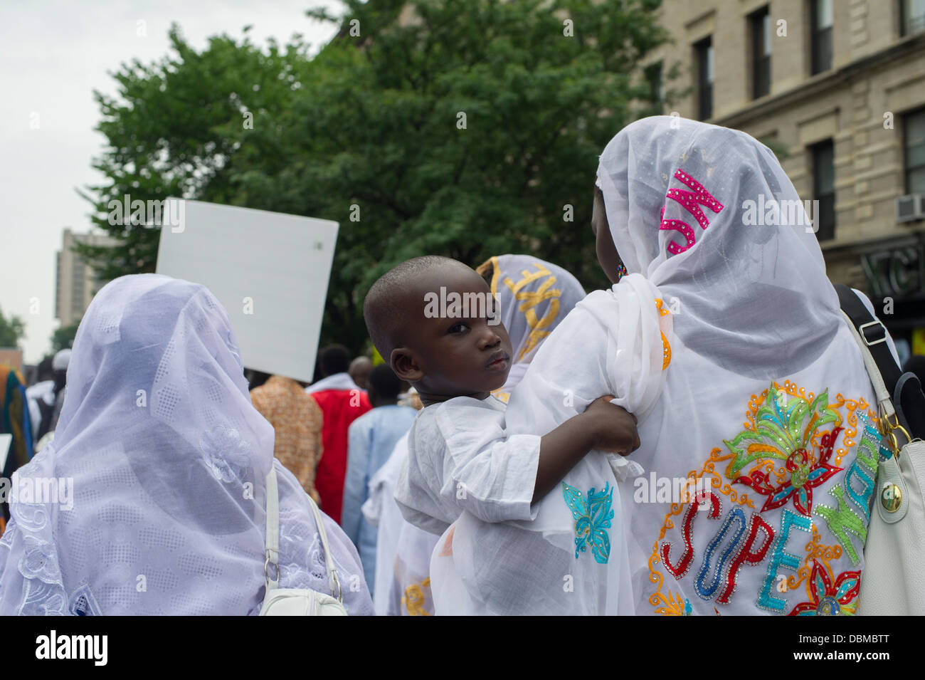 Senegalese immigrants participate in a parade in Harlem in New York commemorating their Shaykh Ahmadou Bamba Stock Photo