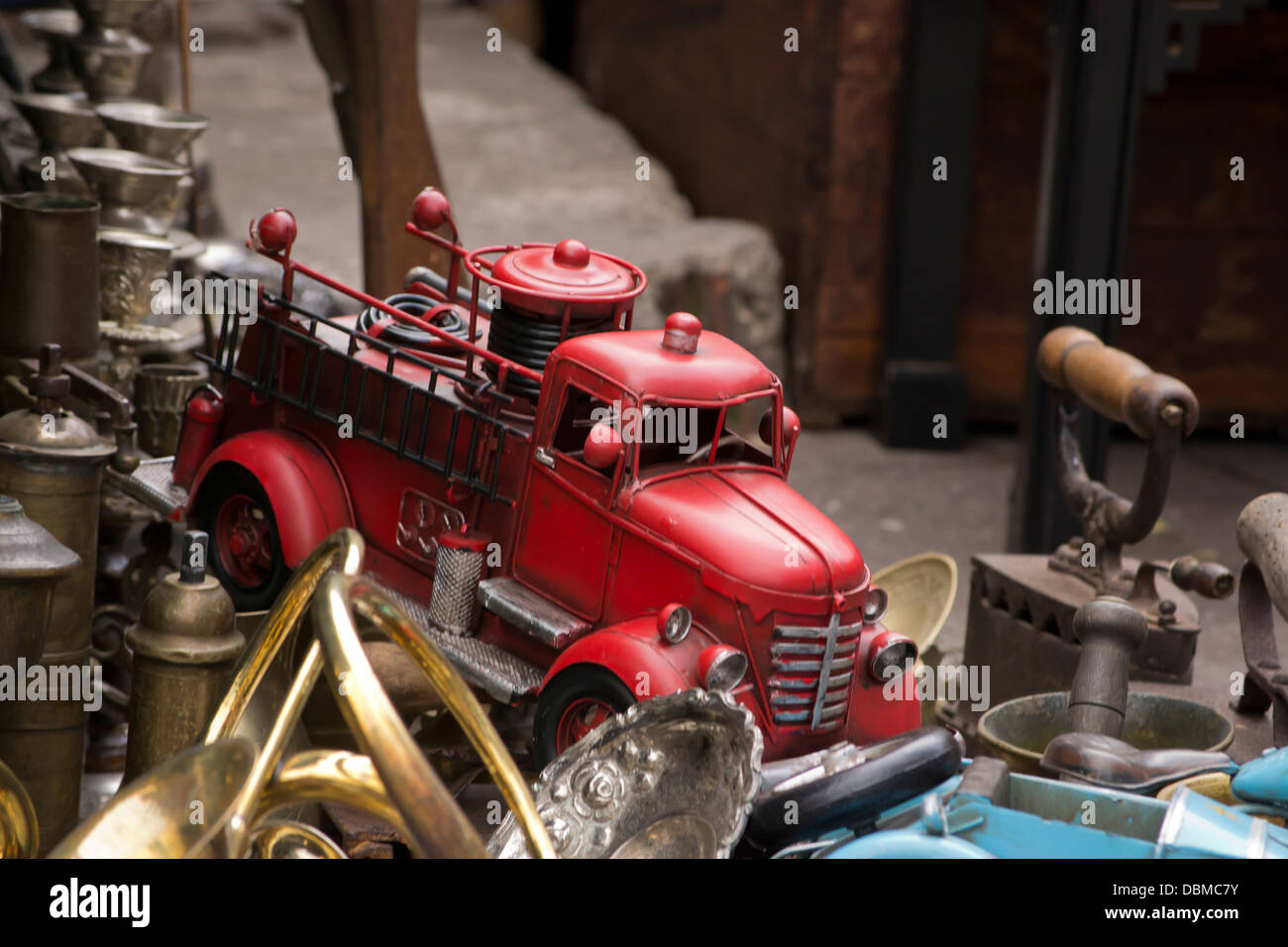 Old vintage fire brigade toy in between collectibles. Stock Photo