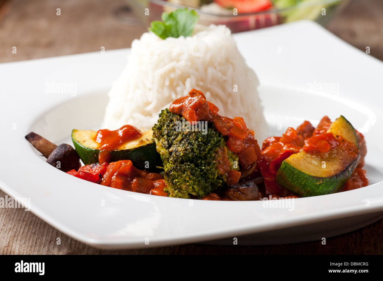 indian zucchini curry dish with rice Stock Photo Alamy