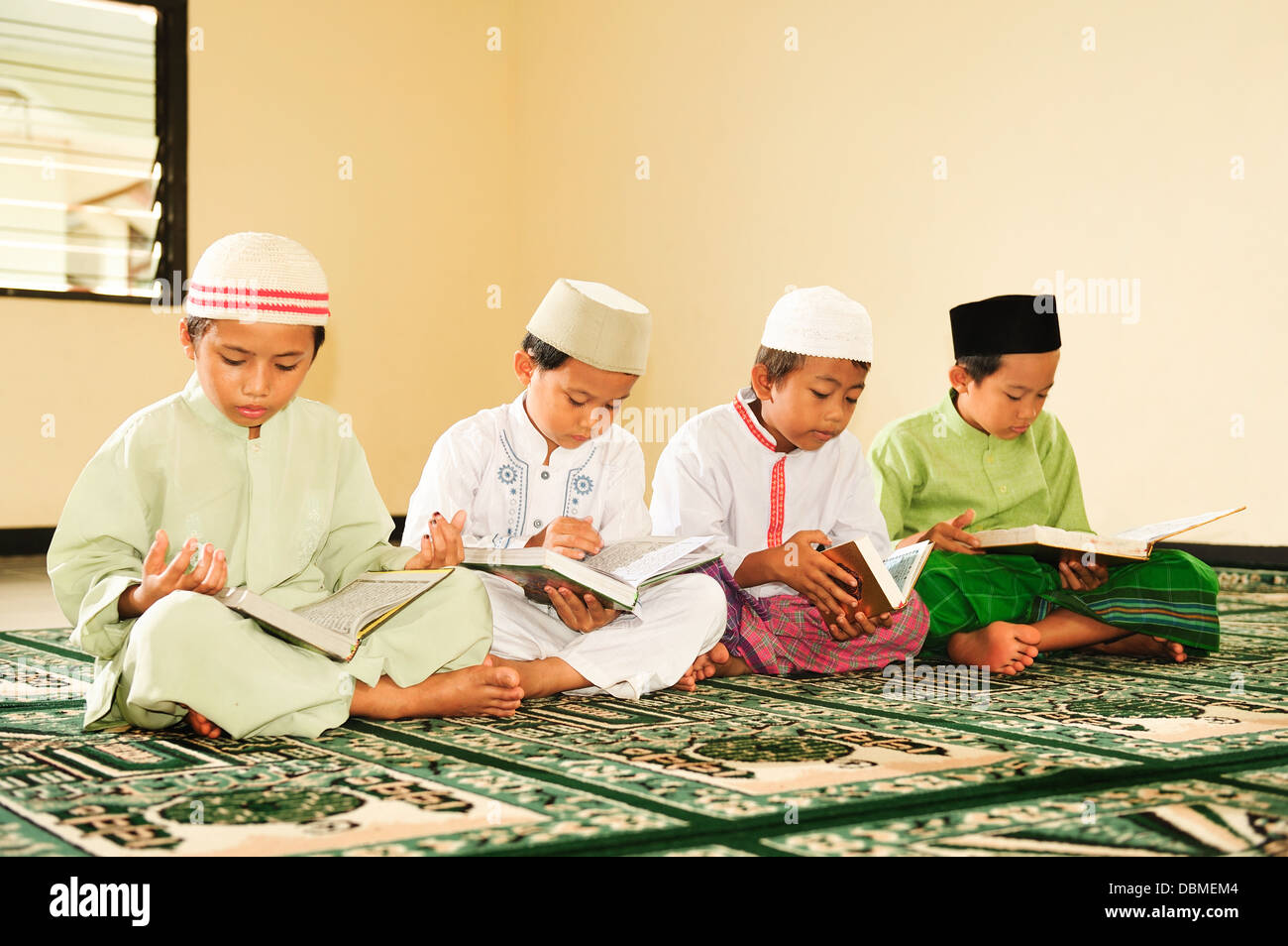 Children reading Koran Stock Photo - Alamy