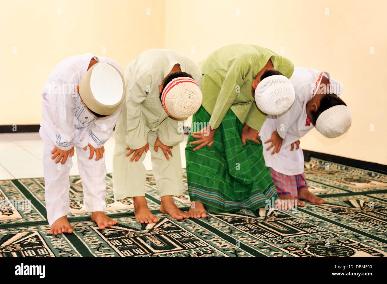 Muslim Kids Praying At Islamic School Stock Photo - Alamy