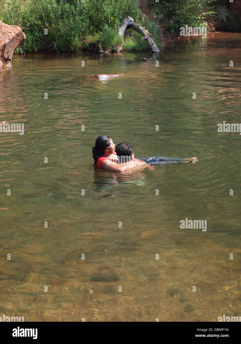 Couple Hug While Swimming At Buddha Beach In Oak Creek At Cathedral Rock A Magnetic Female Energy Vortex Sedona Arizona Usa Stock Photo Alamy