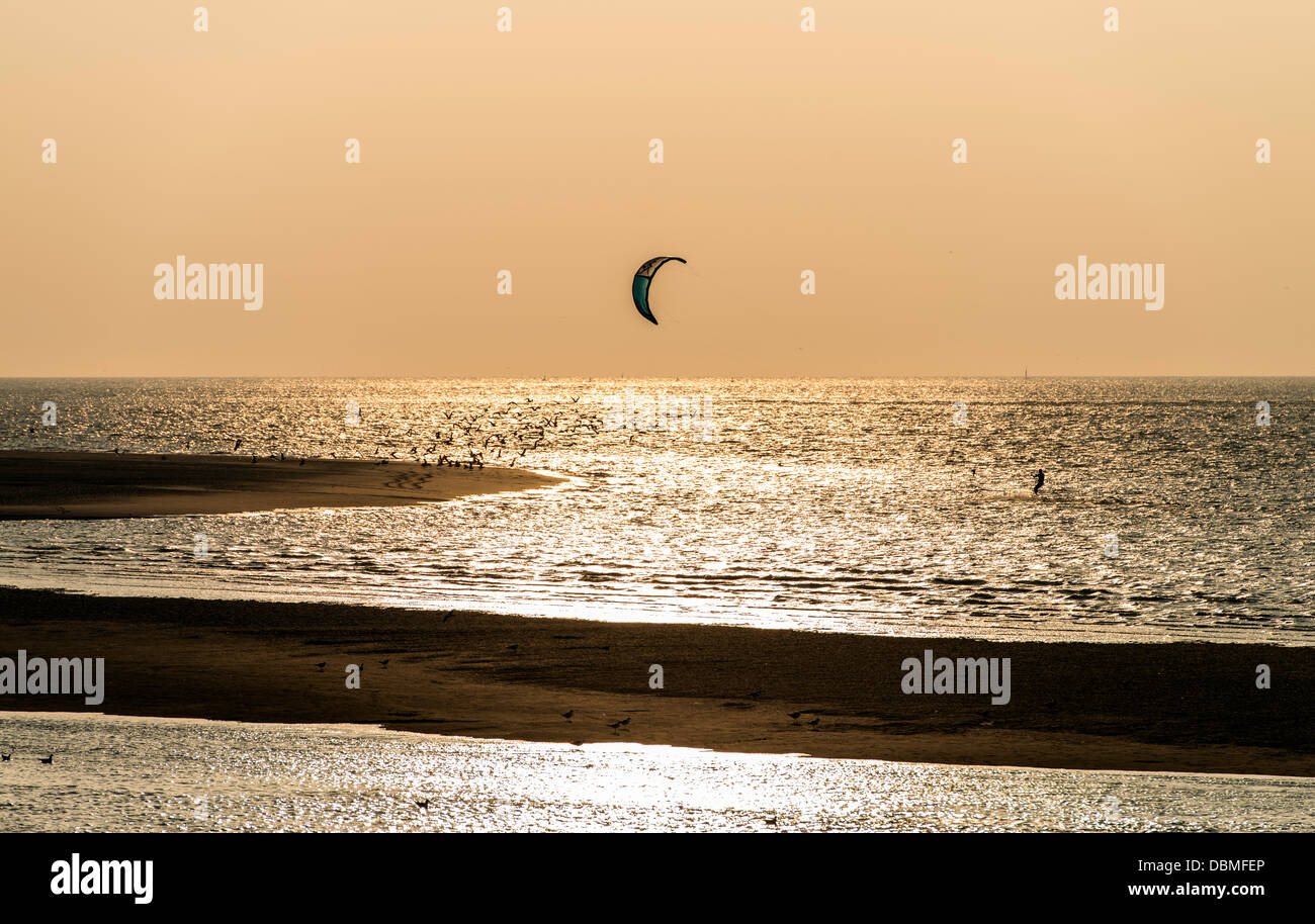 Kite surfing at sunset at Somme bay Picardie France Stock Photo
