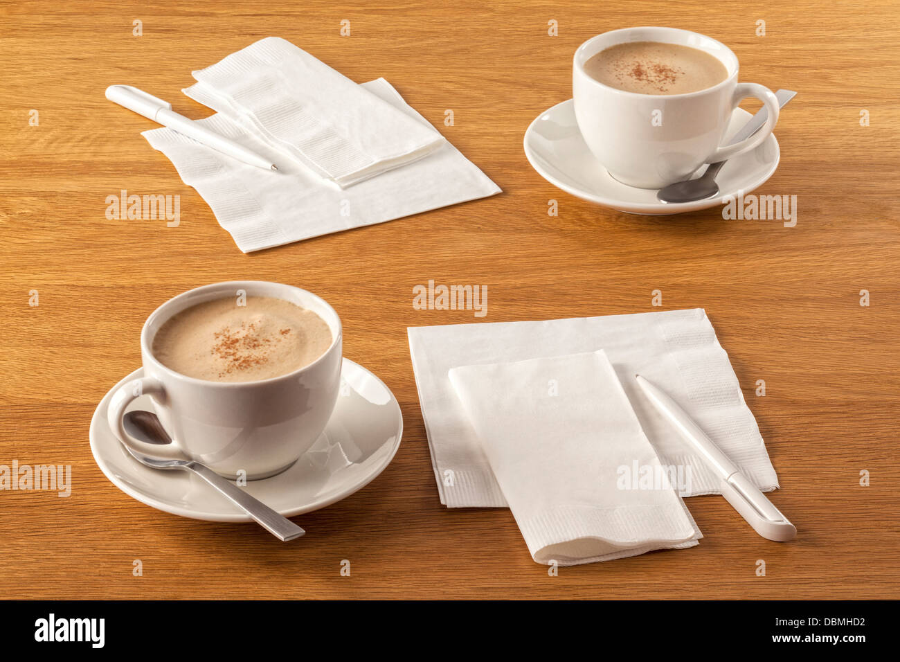 Serviette and Pen - napkins or serviettes and pens on table, ready to make a note of your latest great ideas, along with a... Stock Photo
