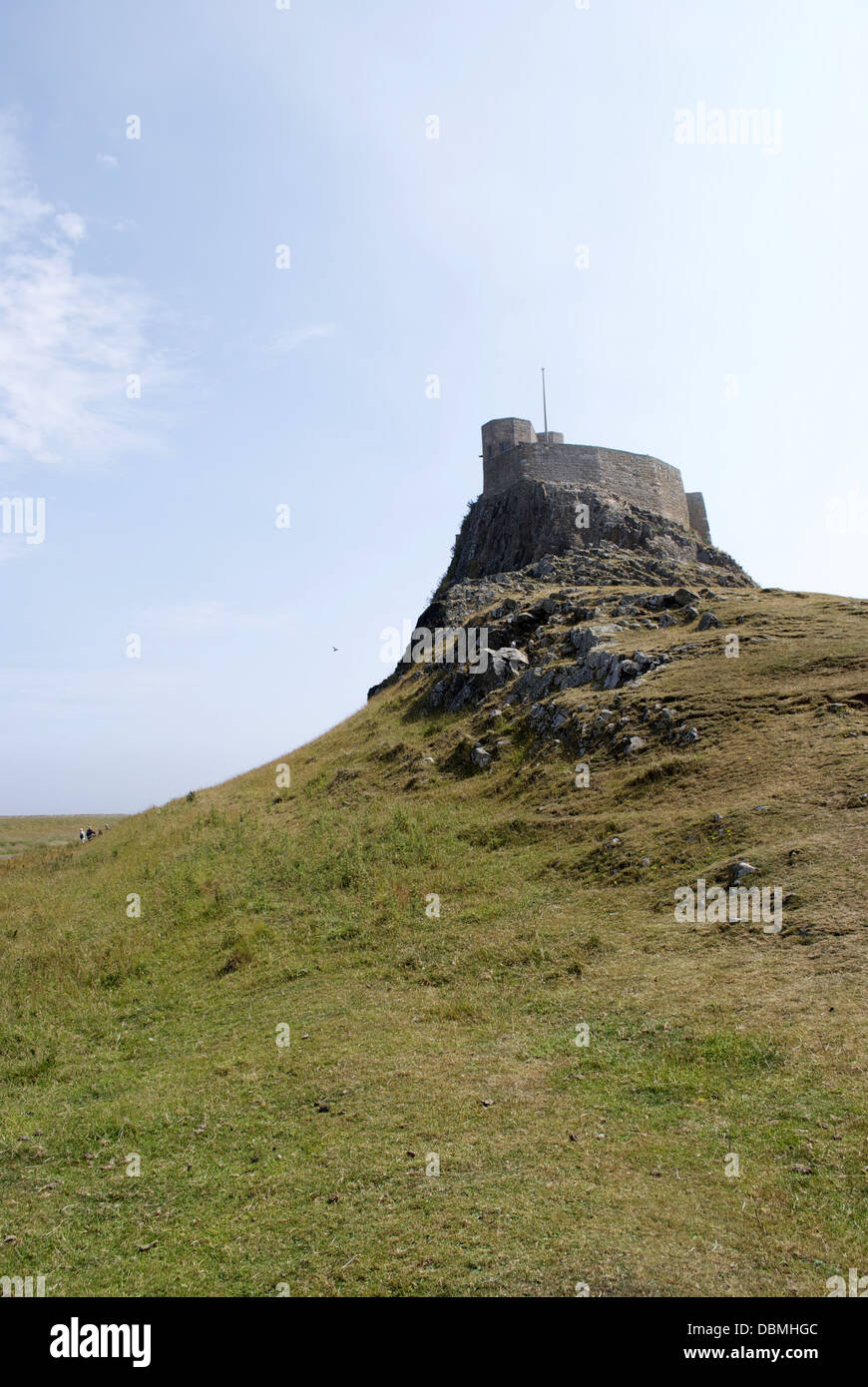 Looking up at the castle on holy island Stock Photo