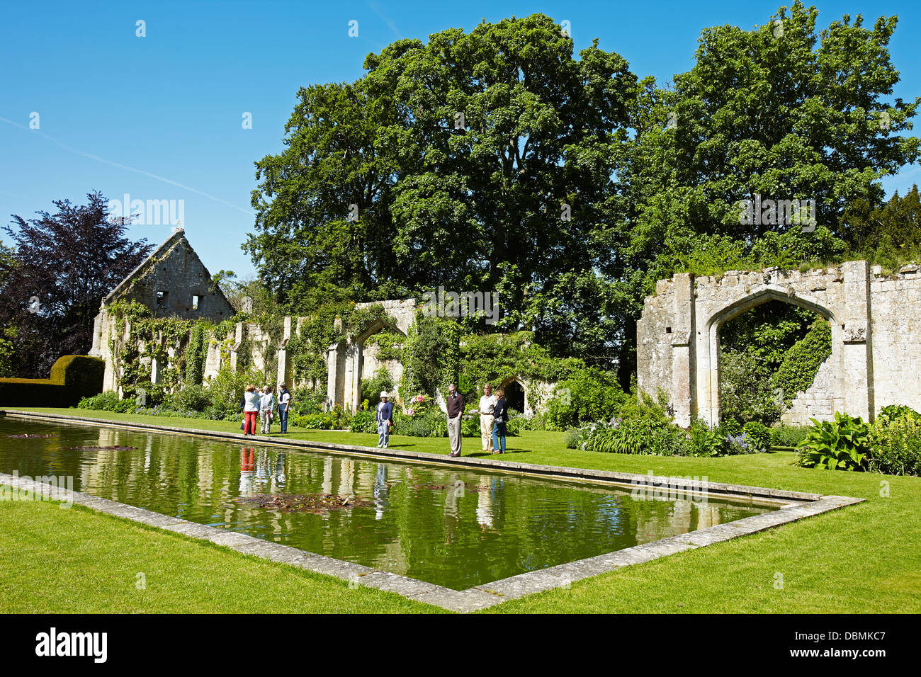 The fish pond and remains of the Tithe Barn, in the grounds of Sudeley Castle near Winchcombe, Gloucestershire, England, UK Stock Photo