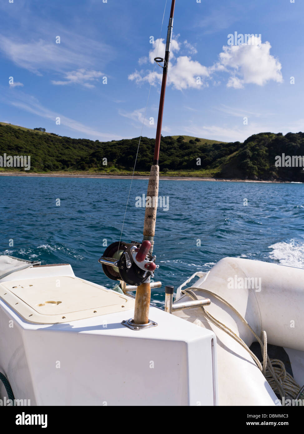 dh  BAY OF ISLANDS NEW ZEALAND Fishing rod and reel on yacht boat Stock Photo