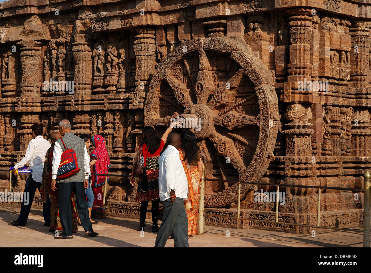 tourist enjoying the stone carving at konark sun temple,orissa,india Stock Photo