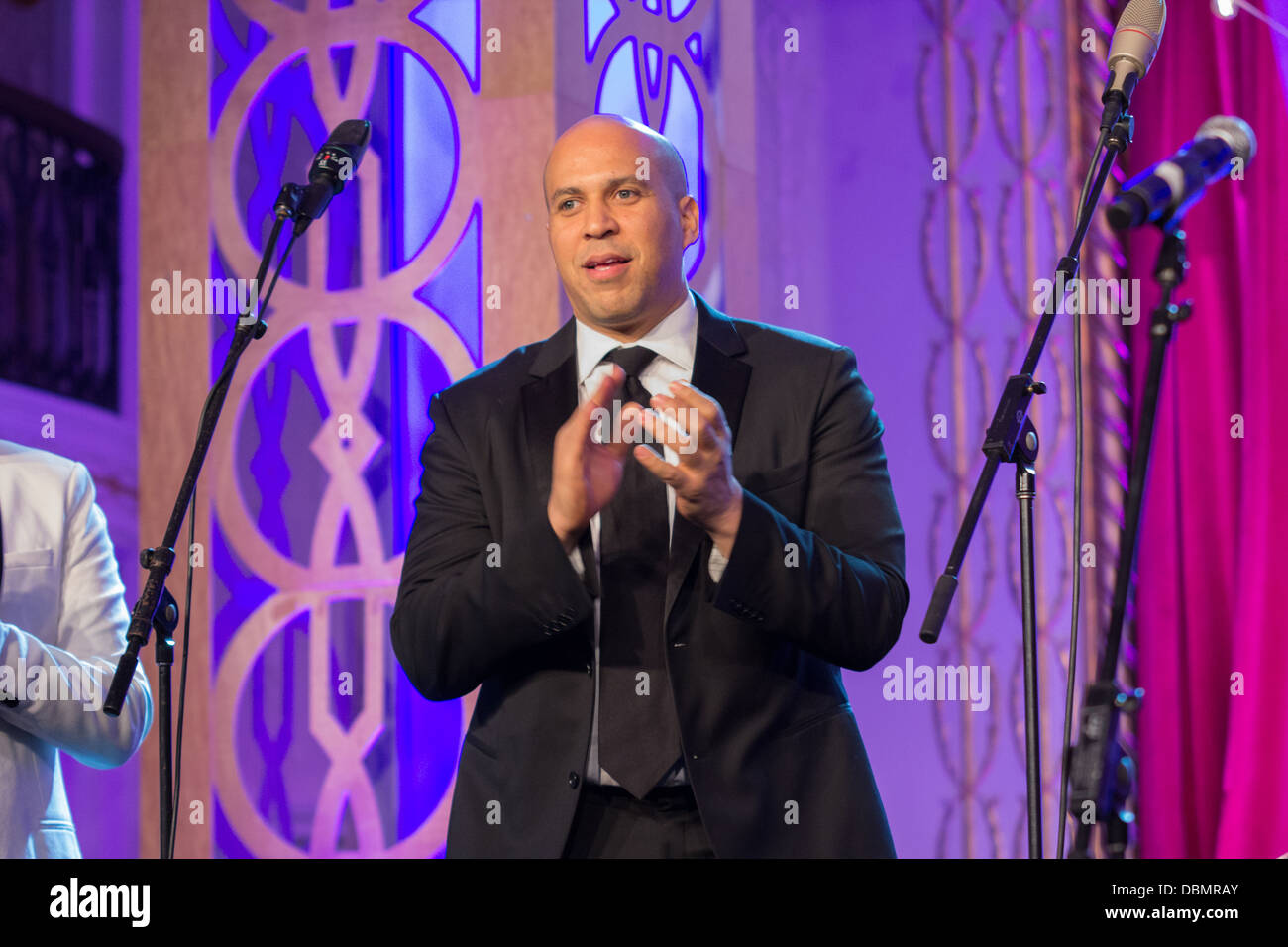 Mayor Cory Booker waits for other speakers to finish welcoming guest at the HRC Out for Equality Ball 2013 Stock Photo
