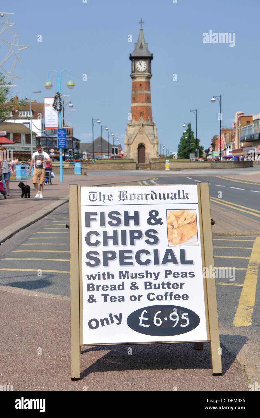 fish and chips special sign and clock tower, Skegness, Lincolnshire, England, UK Stock Photo